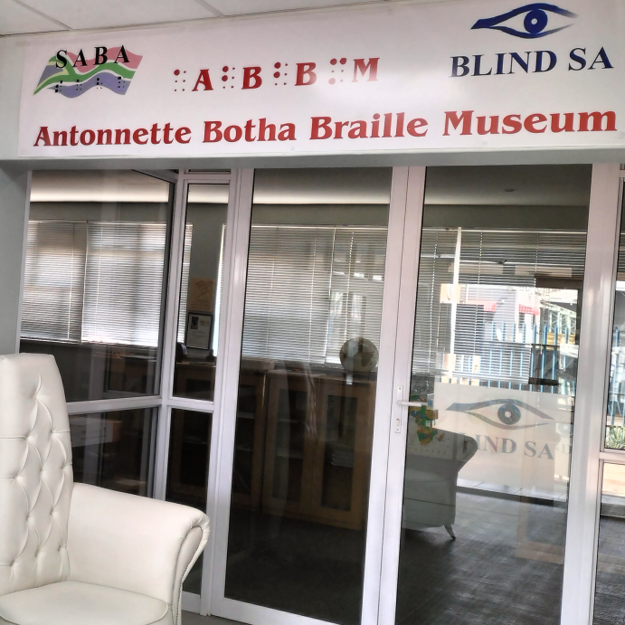 ABBM Museum entrance doors. The AbbM, Blind SA and SABA logo's are above the entrance with certificates hanging to the left. 